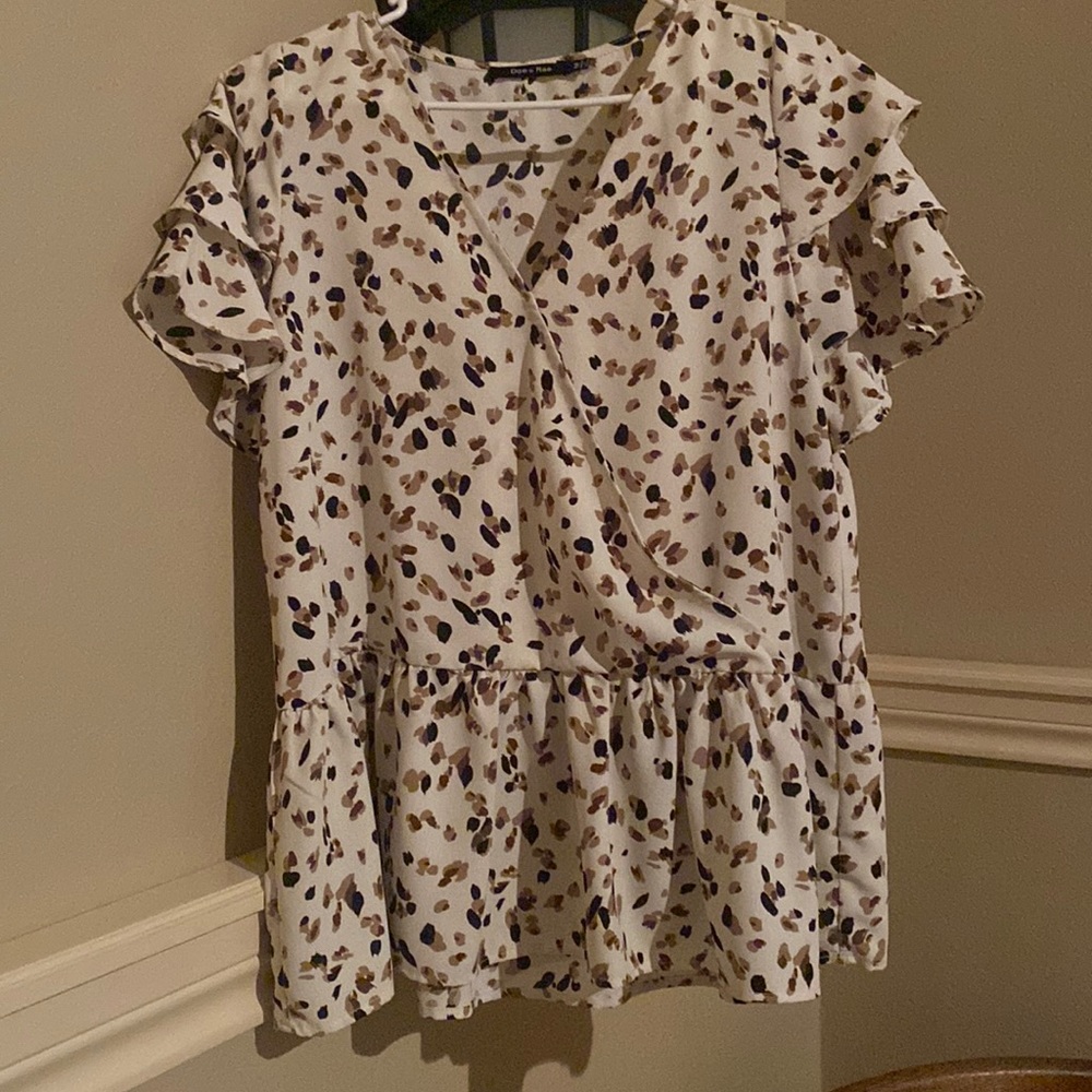 A medium, polyester, Doe and Rae dress shirt with V-neck and ruffled sleeves
